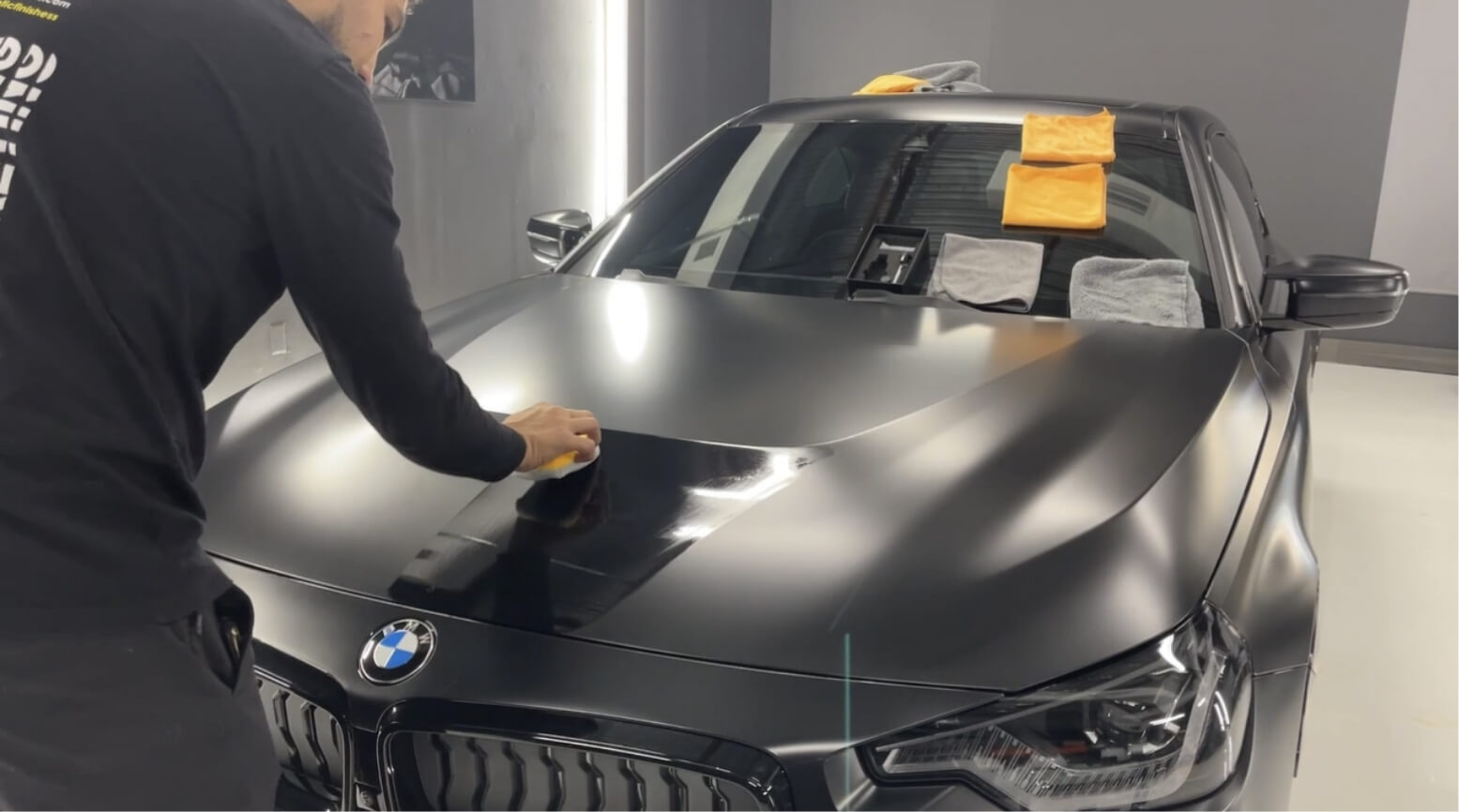 Xepl fusion plus ceramic coating being applied with a sponge on stealth paint protection film on a 2022 BMW m240i.